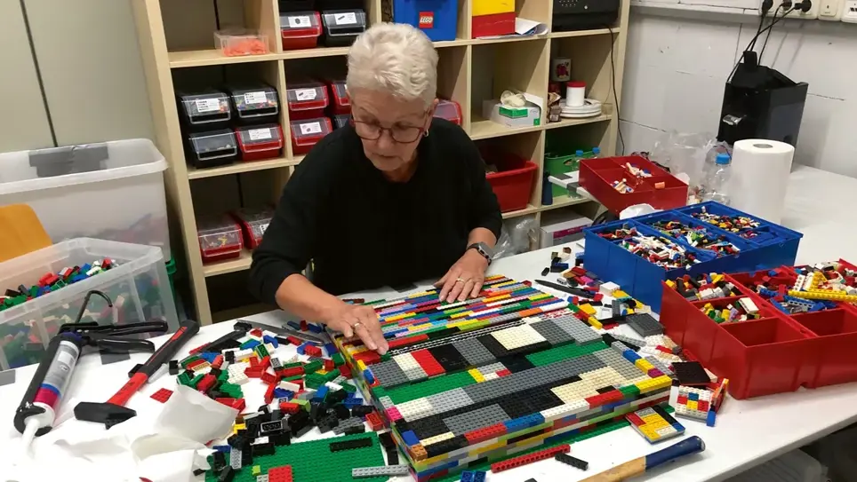 Rita is using LEGO blocks to construct ramps for wheelchairs. 