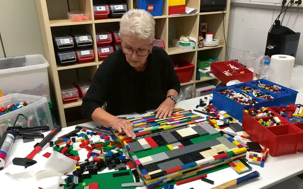 Rita is using LEGO blocks to construct ramps for wheelchairs. 