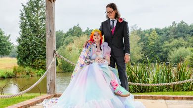 Eliza and Michael on their wedding day. They are both smiling. 