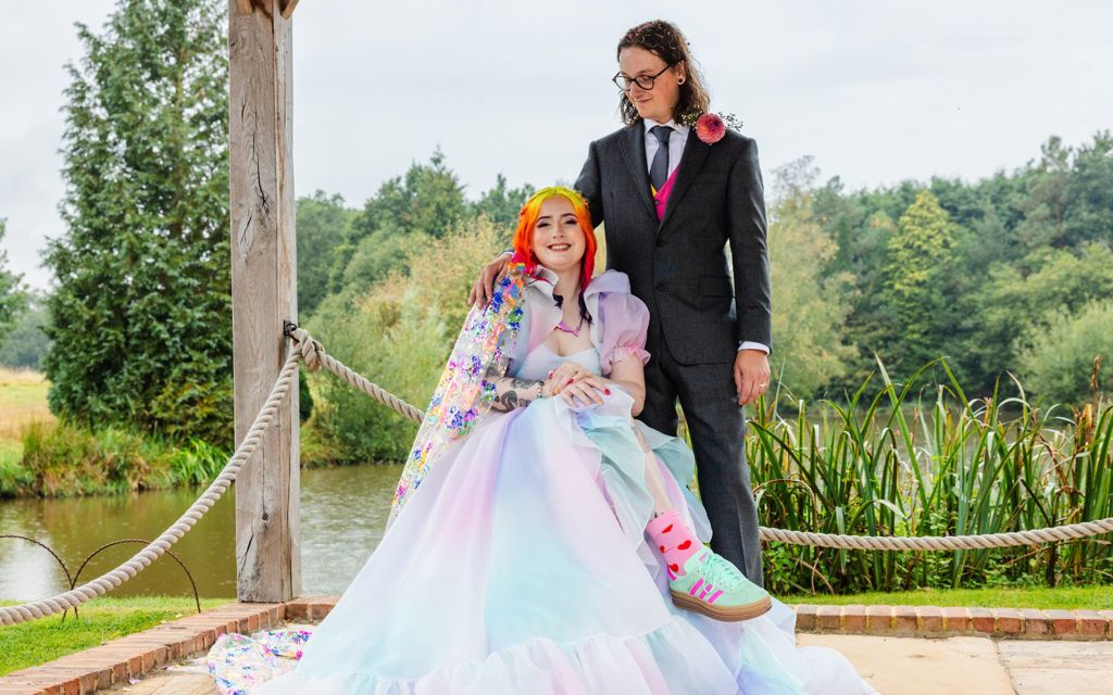 Eliza and Michael on their wedding day. They are both smiling. 