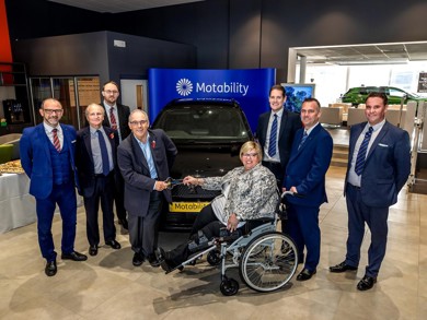 Rt Hon Robert Halfon handing over the keys to Johanna new Motability Scheme car. They are both smiling at the camera.